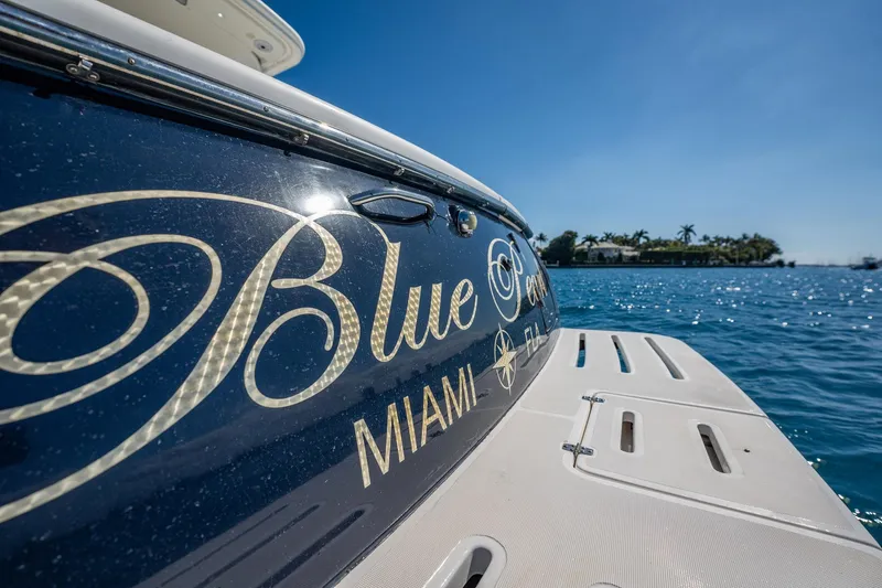 Blue Pearl Yacht Photos Pics 2004 Tiara Yachts 4200 Open, "Blue", docked in Miami, with clear blue skies.