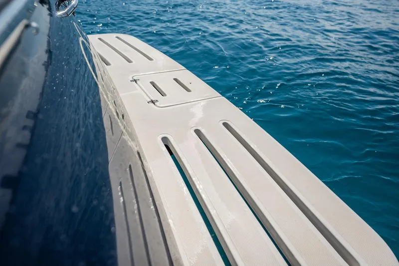 Blue Pearl Yacht Photos Pics 2004 Tiara Yachts 4200 Open swim platform on clear blue water.