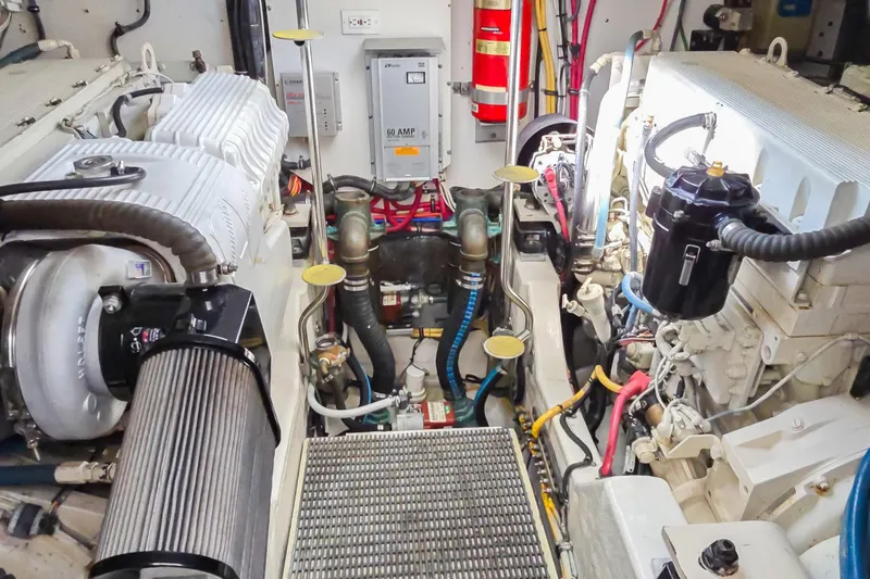 Blue Pearl Yacht Photos Pics Engine room of 2004 Tiara Yachts 4200 Open, showcasing mechanical components and wiring.
