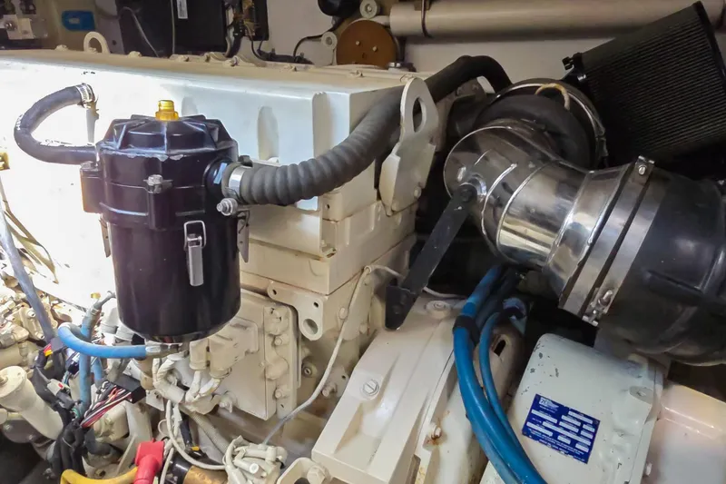 Blue Pearl Yacht Photos Pics Engine compartment of a 2004 Tiara Yachts 4200 Open, showcasing mechanical components and hoses.