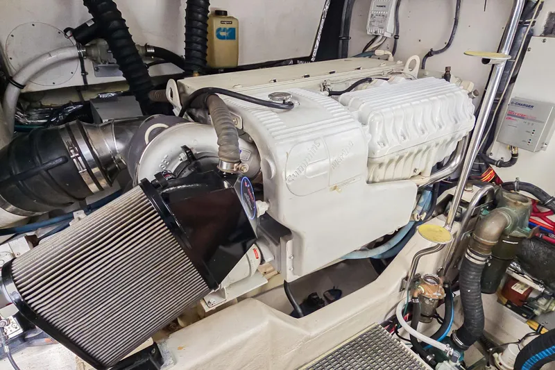 Blue Pearl Yacht Photos Pics Engine room of a 2004 Tiara Yachts 4200 Open, showcasing detailed machinery.