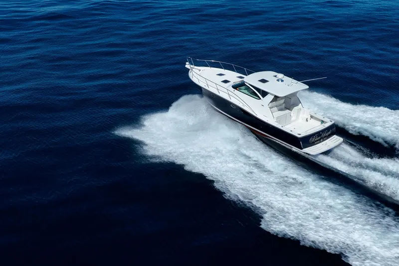 Blue Pearl Yacht Photos Pics 2004 Tiara Yachts 4200 Open cruising on open water, creating a dynamic wake.