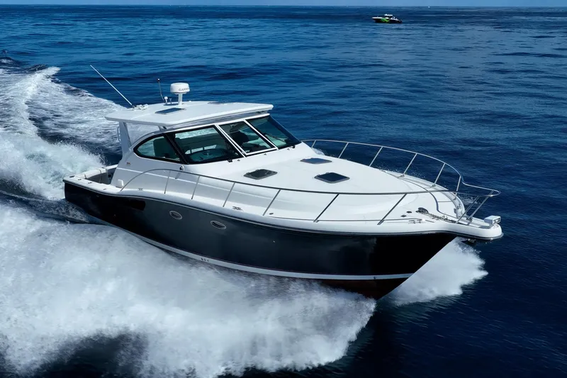 Blue Pearl Yacht Photos Pics 2004 Tiara Yachts 4200 Open cruising on open water, showcasing sleek design and performance.