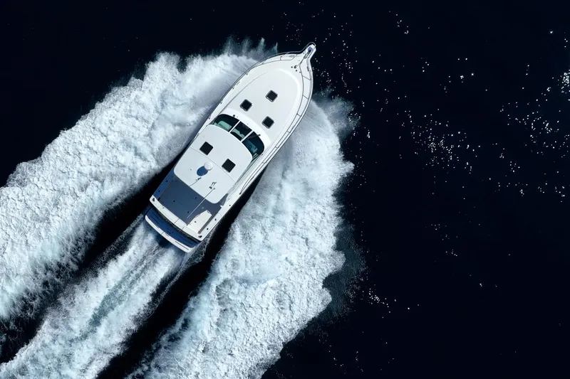 Blue Pearl Yacht Photos Pics Aerial view of 2004 Tiara Yachts 4200 Open cruising on open water.