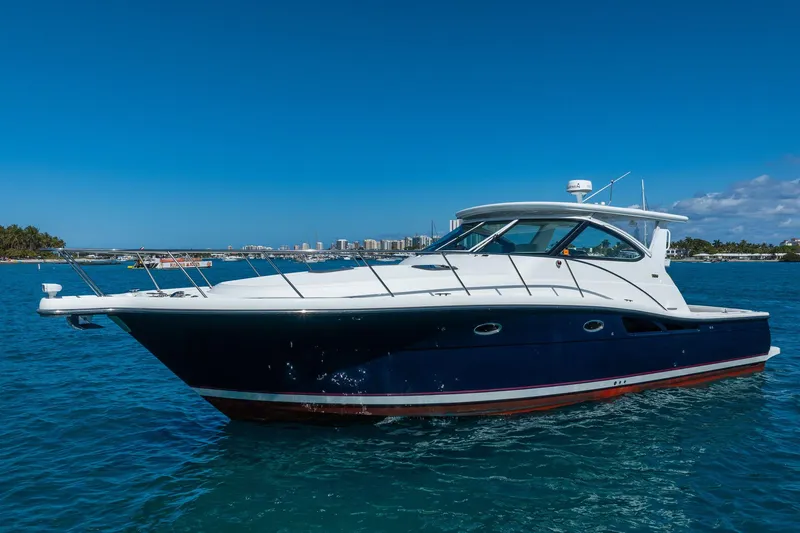 Blue Pearl Yacht Photos Pics 2004 Tiara Yachts 4200 Open cruising on clear blue water under a sunny sky.