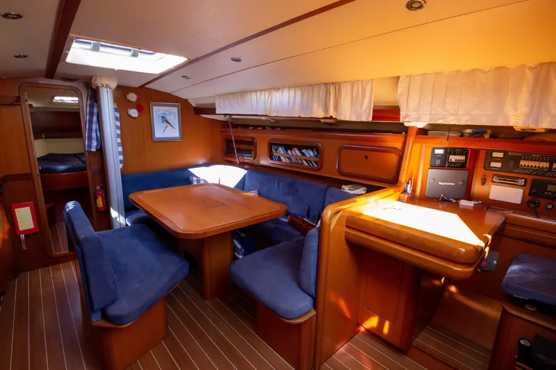  Yacht Photos Pics Interior of 2005 Grand Soleil 43 yacht with cozy seating and wooden finishes.