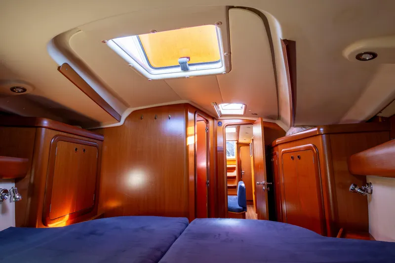  Yacht Photos Pics Luxurious interior of 2005 Grand Soleil 43 yacht with wooden cabinetry and skylight.