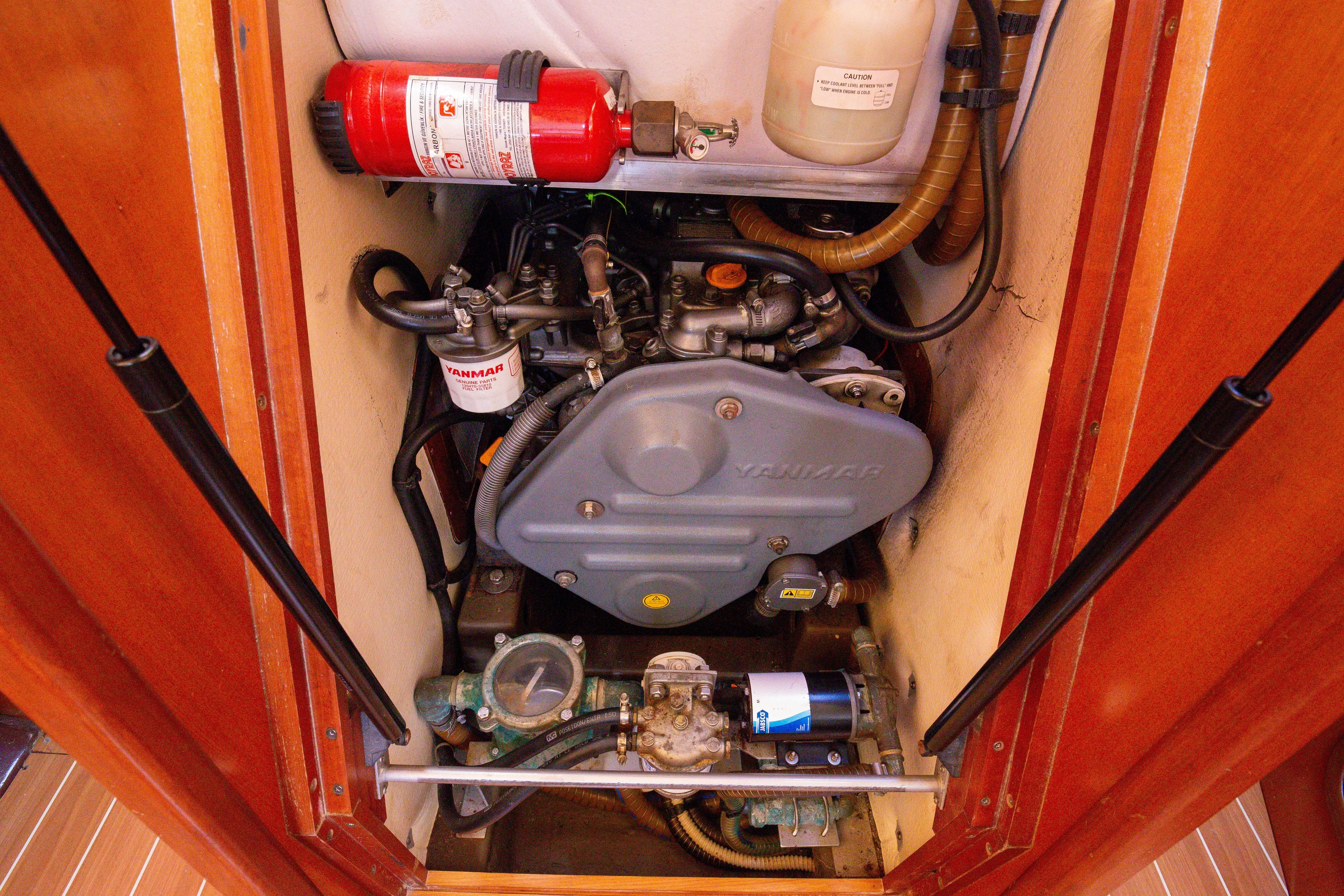  Yacht Photos Pics Engine compartment of 2005 Grand Soleil 43 yacht with Yanmar engine and fire extinguisher.
