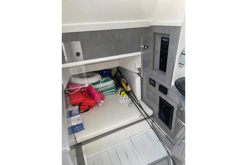  Yacht Photos Pics 2019 HCB 42 Siesta cabin interior with fishing gear and safety equipment.