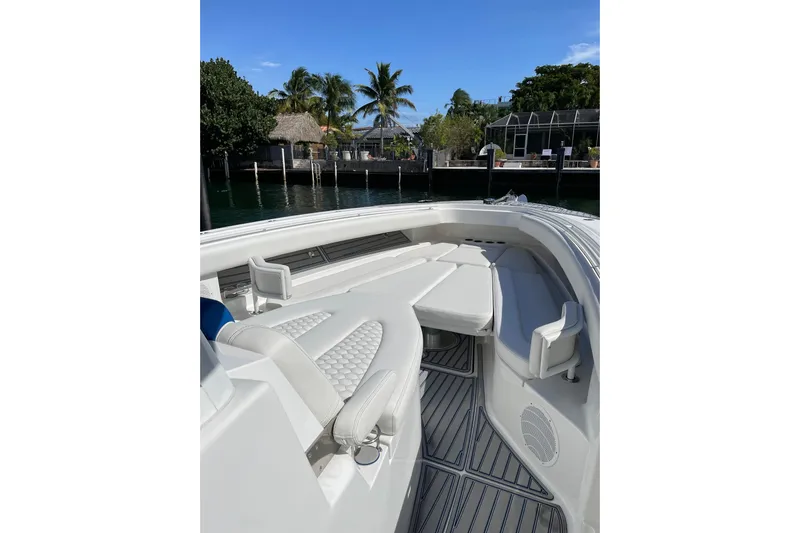  Yacht Photos Pics 2019 HCB 42 Siesta boat interior with white seating and tropical background.