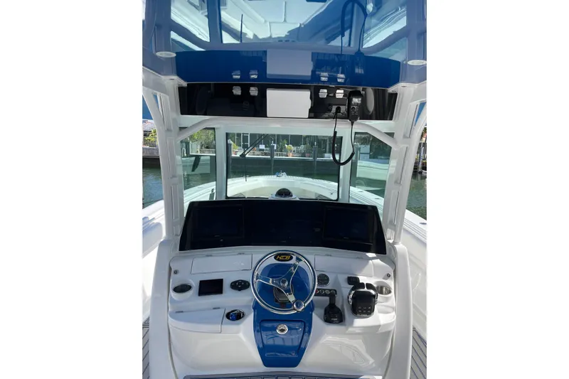  Yacht Photos Pics 2019 HCB 42 Siesta boat helm with modern controls and blue accents.