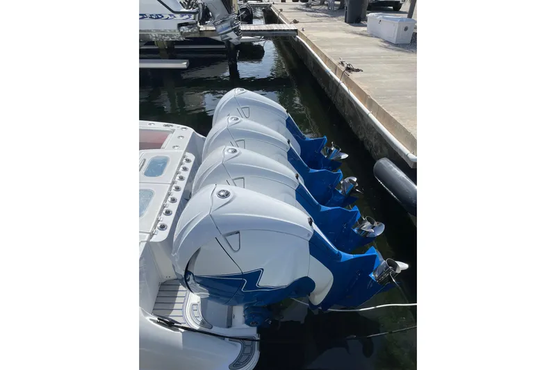  Yacht Photos Pics 2019 HCB 42 Siesta boat with four powerful outboard engines docked.