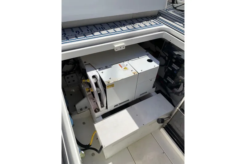  Yacht Photos Pics Engine compartment of a 2019 HCB 42 Siesta boat, showcasing mechanical components.