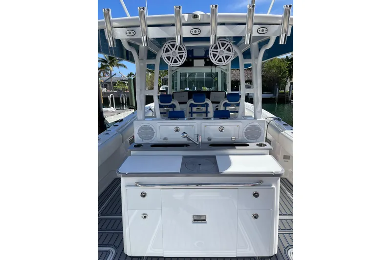  Yacht Photos Pics 2019 HCB 42 Siesta boat with sleek white interior and fishing rod holders.