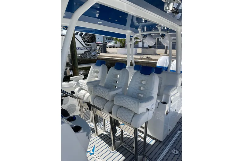  Yacht Photos Pics 2019 HCB 42 Siesta boat interior with luxurious white seating and blue accents.