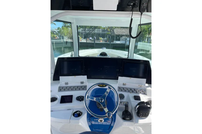  Yacht Photos Pics Helm of 2019 HCB 42 Siesta boat with modern controls and navigation screens.