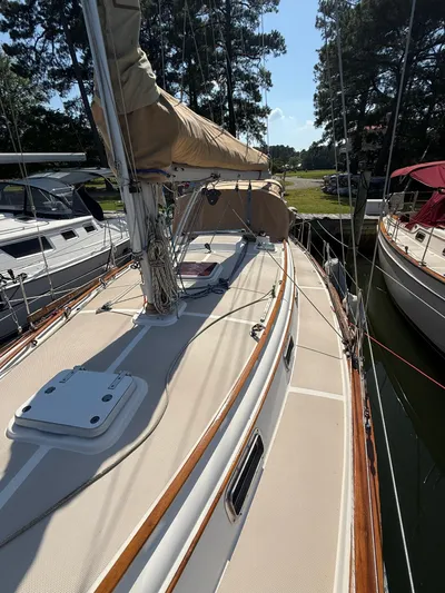Moonsplash Yacht Photos Pics 1987 Island Packet 38 sailboat docked, showcasing deck and rigging under clear skies.