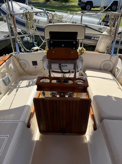 Moonsplash Yacht Photos Pics 1987 Island Packet 38 sailboat cockpit with seating, steering wheel, and cup holders.