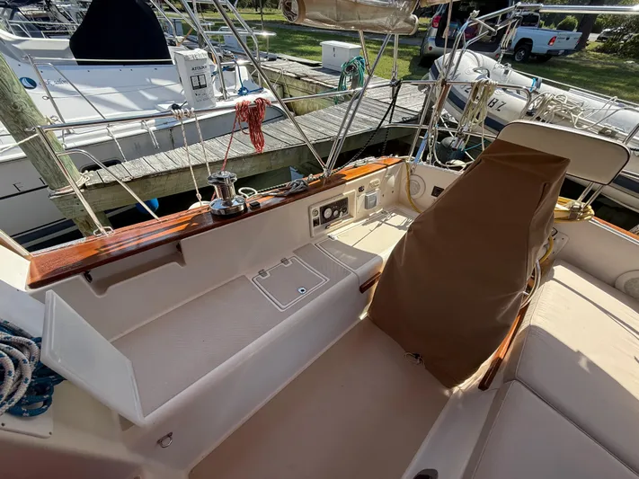 Moonsplash Yacht Photos Pics Cockpit of 1987 Island Packet 38 sailboat with covered helm and docked surroundings.
