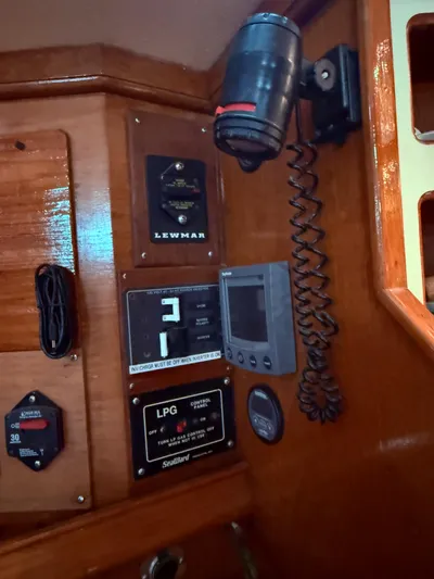 Moonsplash Yacht Photos Pics Control panel of a 1987 Island Packet 38 sailboat with various instruments and switches.