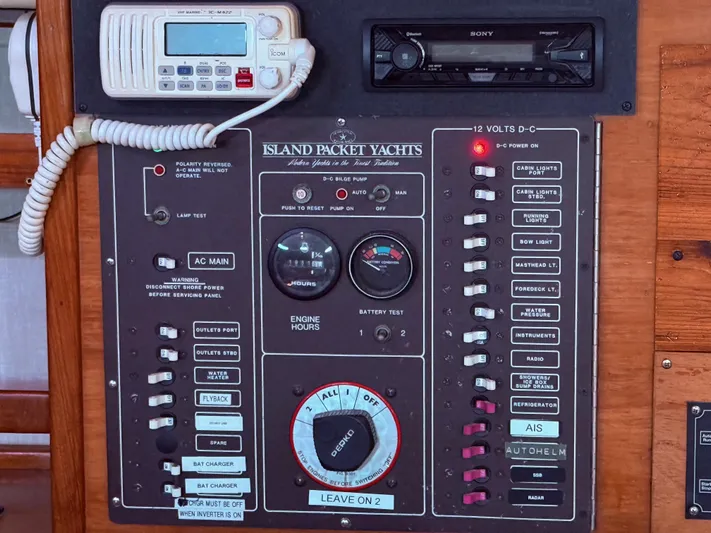Moonsplash Yacht Photos Pics Control panel of a 1987 Island Packet 38 yacht with various switches and gauges.