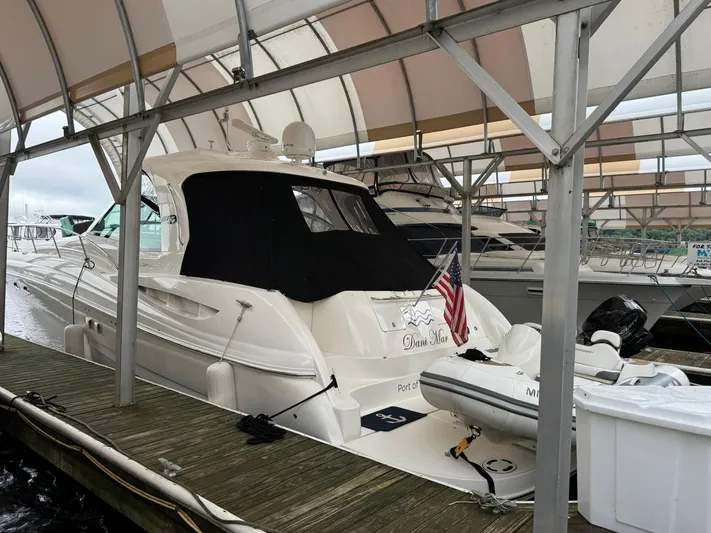 Dani Mar Yacht Photos Pics 2003 Sea Ray 500 Sundancer yacht docked under a canopy.