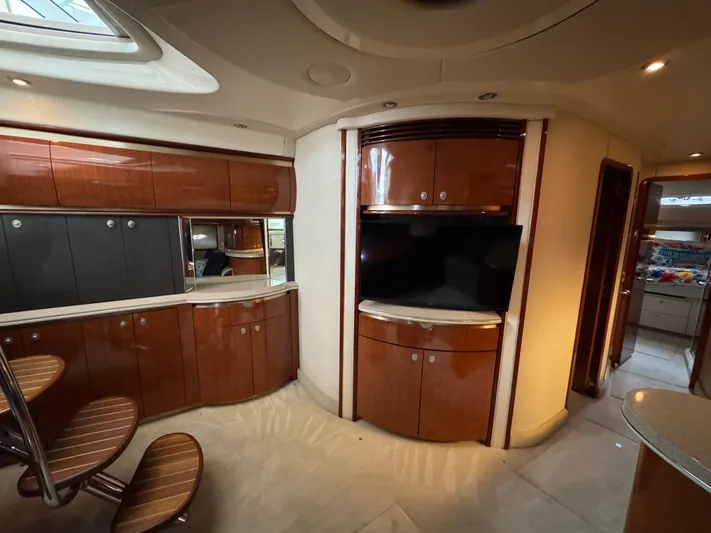 Dani Mar Yacht Photos Pics Luxurious interior of 2003 Sea Ray 500 Sundancer yacht with wood cabinetry and modern amenities.