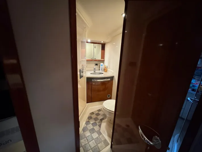 Dani Mar Yacht Photos Pics Bathroom interior of 2003 Sea Ray 500 Sundancer yacht, featuring sink and toilet.