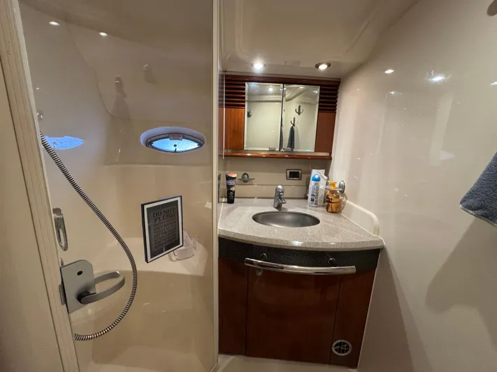 Dani Mar Yacht Photos Pics Bathroom interior of 2003 Sea Ray 500 Sundancer yacht, featuring sink and shower.