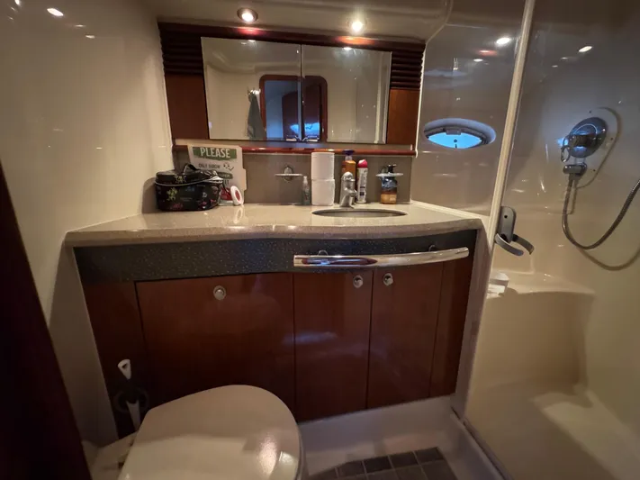 Dani Mar Yacht Photos Pics Luxurious bathroom in 2003 Sea Ray 500 Sundancer yacht with modern fixtures and shower.