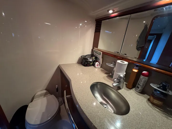 Dani Mar Yacht Photos Pics Bathroom interior of 2003 Sea Ray 500 Sundancer yacht with sink and toilet.