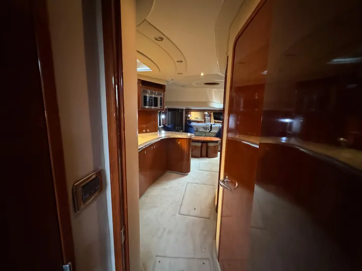 Dani Mar Yacht Photos Pics Interior of 2003 Sea Ray 500 Sundancer yacht with polished wood and modern amenities.
