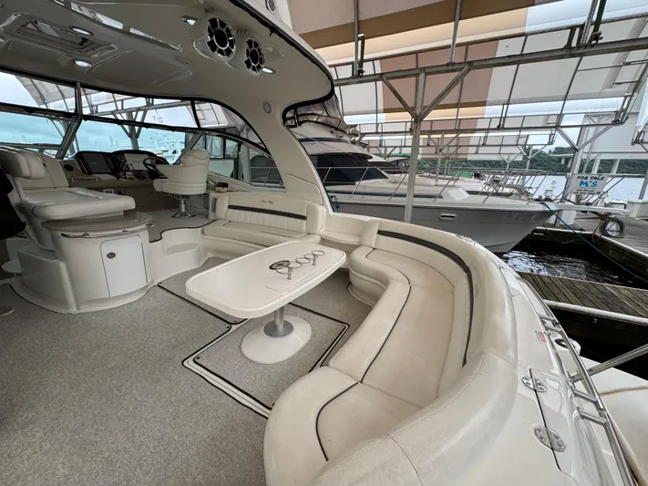 Dani Mar Yacht Photos Pics 2003 Sea Ray 500 Sundancer yacht interior with plush seating and helm station.