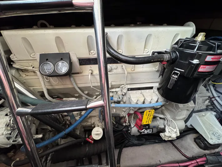 Dani Mar Yacht Photos Pics Engine compartment of a 2003 Sea Ray 500 Sundancer boat, showing detailed components and wiring.