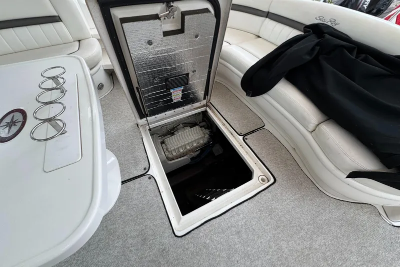 Dani Mar Yacht Photos Pics 2003 Sea Ray 500 Sundancer interior with open engine hatch, revealing engine compartment.