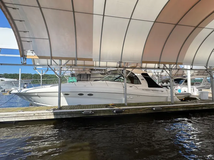 Dani Mar Yacht Photos Pics 2003 Sea Ray 500 Sundancer yacht docked under a canopy.