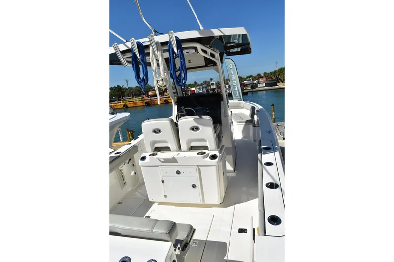  Yacht Photos Pics 2022 Pursuit S 268 Sport boat interior with seating and fishing rod holders.