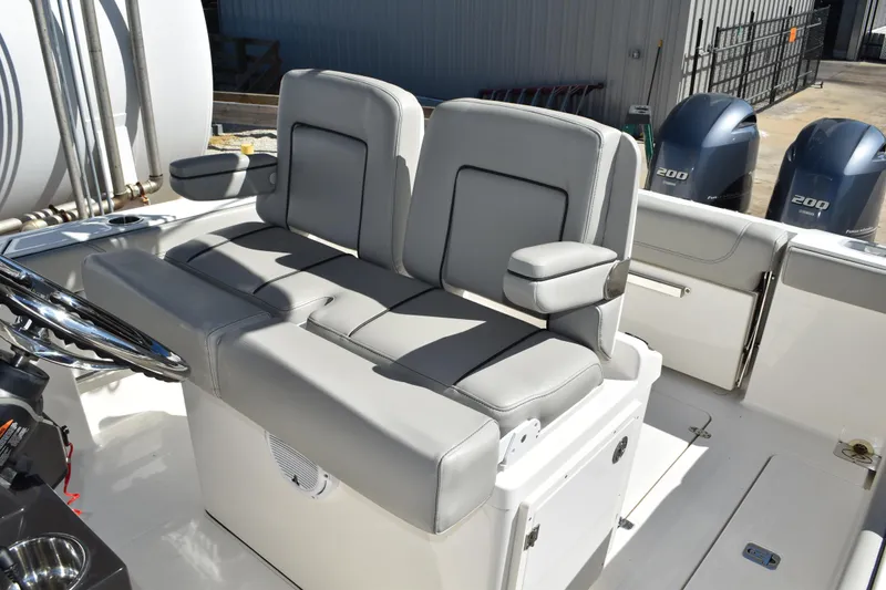  Yacht Photos Pics 2022 Pursuit S 268 Sport boat interior with dual seats and twin 200 horsepower engines.