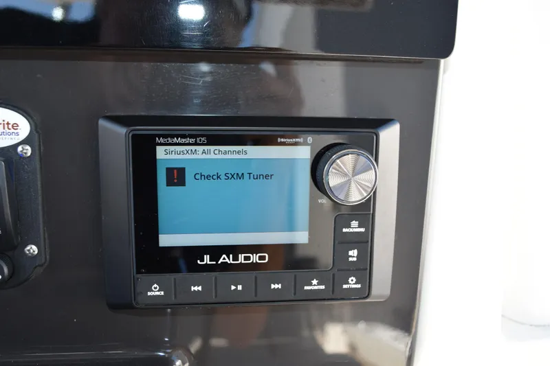  Yacht Photos Pics JL Audio MediaMaster display on 2022 Pursuit S 268 Sport, showing "Check SXM Tuner" alert.
