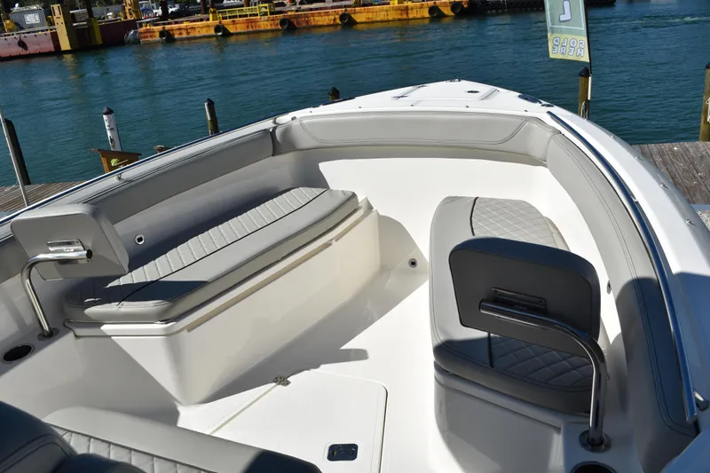  Yacht Photos Pics 2022 Pursuit S 268 Sport boat interior with cushioned seating and sleek design.