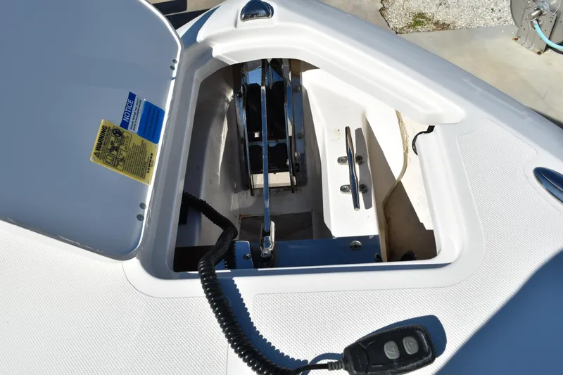  Yacht Photos Pics Anchor compartment of 2022 Pursuit S 268 Sport boat with control panel.