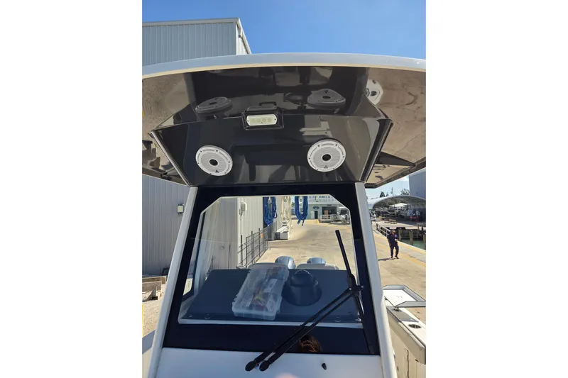  Yacht Photos Pics 2022 Pursuit S 268 Sport boat console with speakers and windshield wipers.