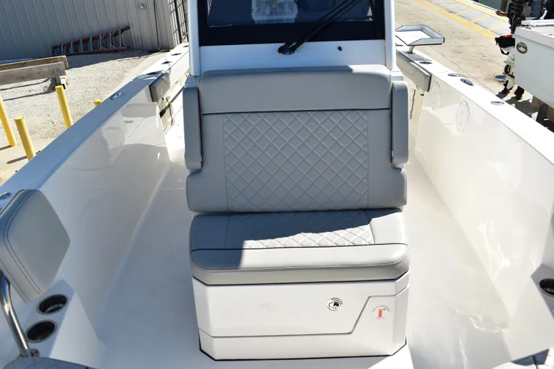 Yacht Photos Pics 2022 Pursuit S 268 Sport boat interior with cushioned seating and storage.
