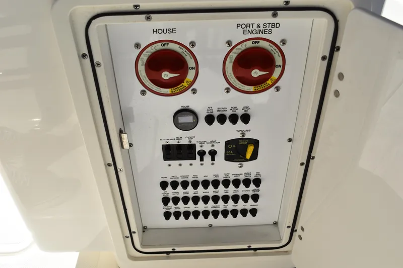  Yacht Photos Pics Control panel of a 2022 Pursuit S 268 Sport boat, featuring switches and dials.