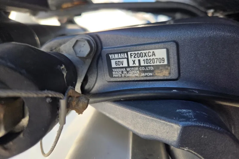  Yacht Photos Pics Close-up of Yamaha F200XCA engine label on 2022 Pursuit S 268 Sport boat.