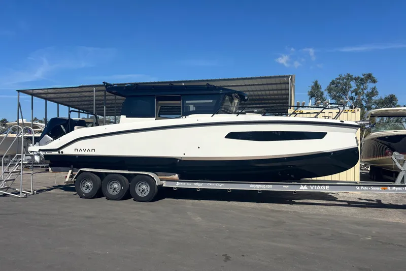  Yacht Photos Pics 2026 Navan C30 boat on trailer under clear blue sky.