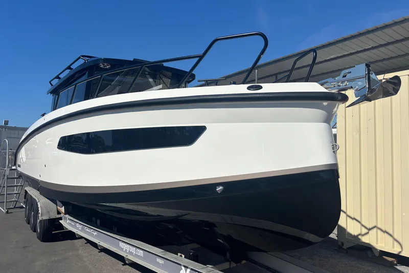  Yacht Photos Pics 2026 Navan C30 boat on trailer under clear blue sky.