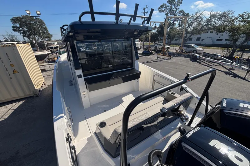  Yacht Photos Pics 2026 Navan C30 boat with Mercury engines, docked outdoors under a clear blue sky.