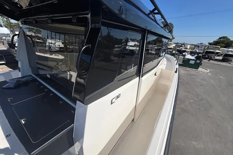  Yacht Photos Pics 2026 Navan C30 boat with sleek design and modern features, docked outdoors.
