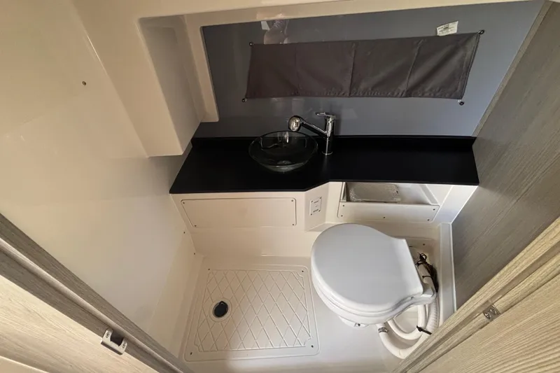  Yacht Photos Pics Compact bathroom in 2026 Navan C30 with modern fixtures and sleek design.
